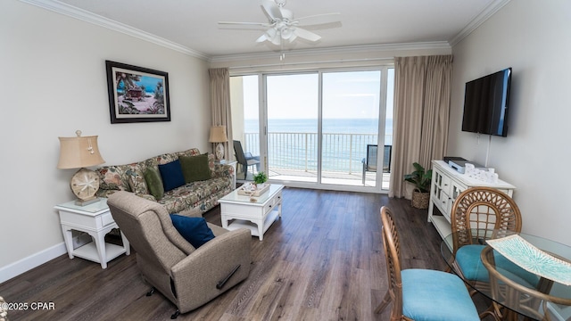 living room featuring ceiling fan, baseboards, crown molding, and wood finished floors