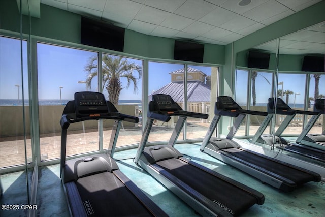 exercise room with a drop ceiling