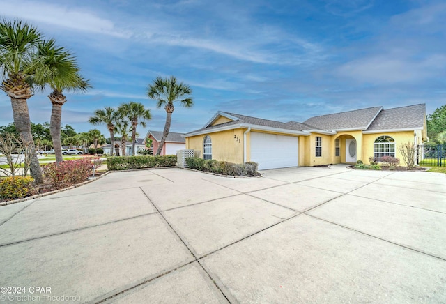 single story home featuring a garage