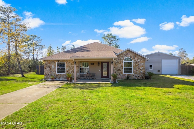 ranch-style house with covered porch, a front lawn, and a garage