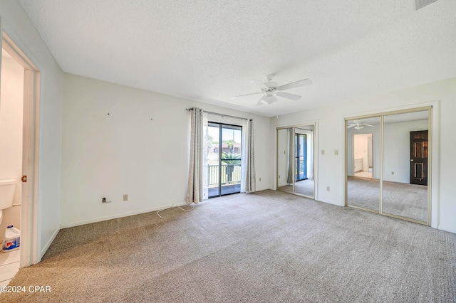 unfurnished room featuring ceiling fan, a textured ceiling, and carpet flooring