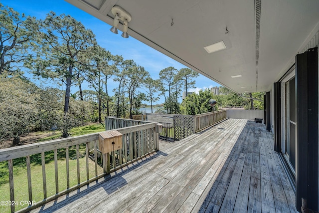 deck featuring a lawn