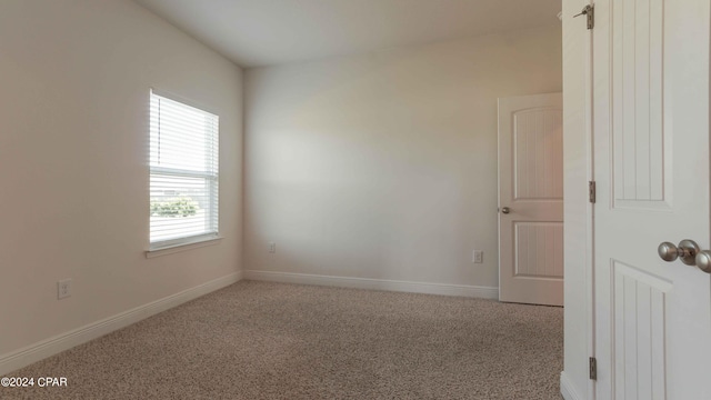 empty room with light colored carpet