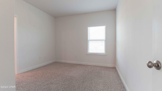 empty room with light colored carpet