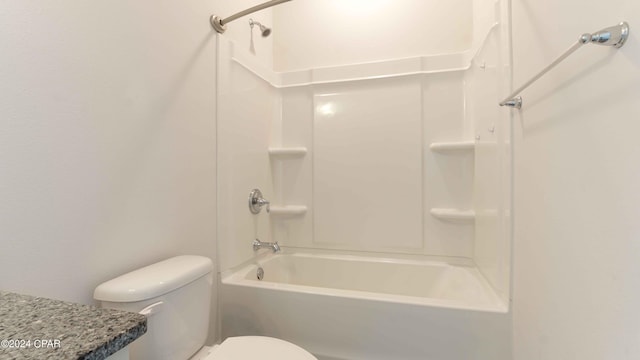 bathroom featuring shower / bathing tub combination and toilet