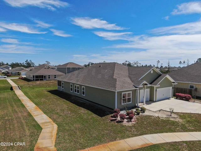 single story home featuring a garage and a front lawn