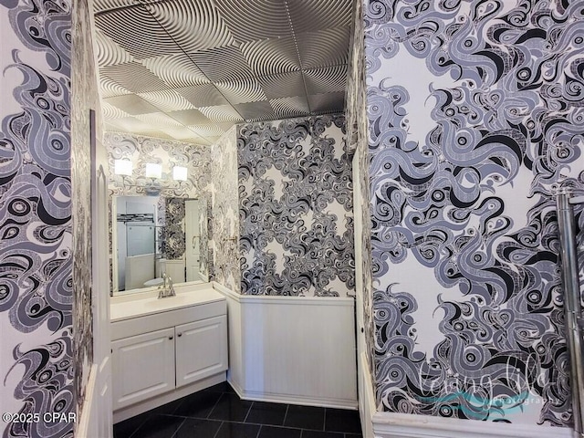 bathroom with tile patterned flooring and vanity