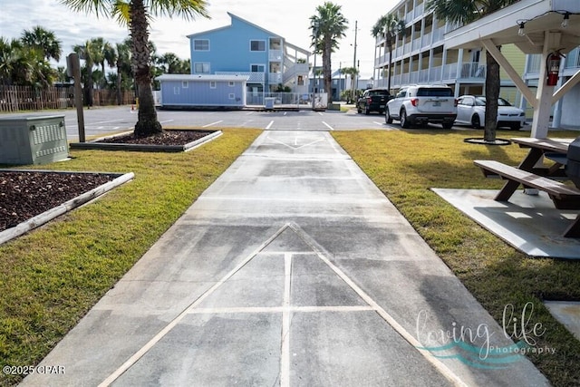 view of community with a yard