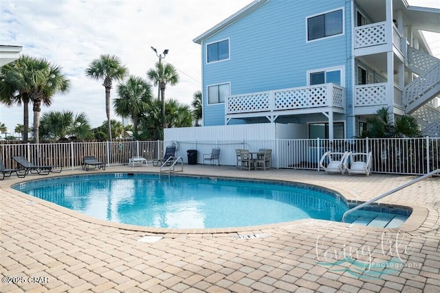 view of swimming pool with a patio