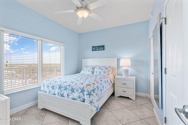 tiled bedroom with ceiling fan