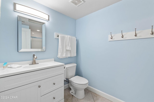 bathroom featuring oversized vanity, toilet, and tile flooring