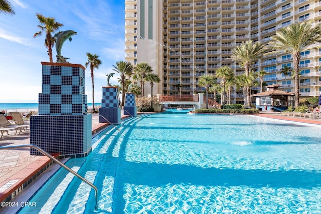 view of pool with pool water feature