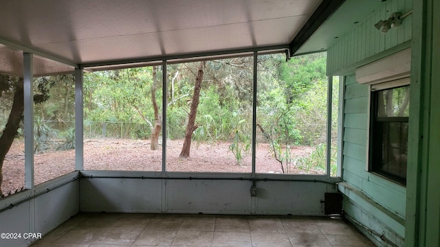 unfurnished sunroom with plenty of natural light