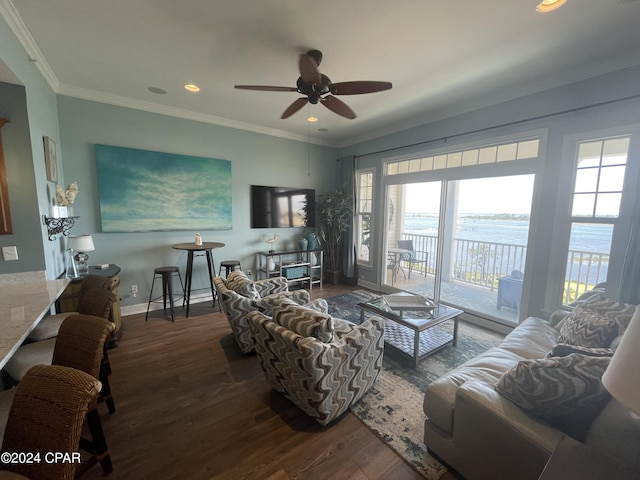 living area featuring baseboards, ceiling fan, dark wood-style flooring, crown molding, and recessed lighting