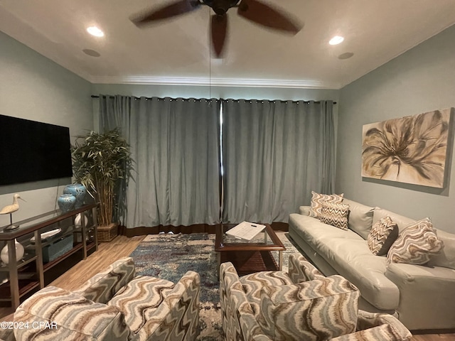 living area with a ceiling fan, wood finished floors, and recessed lighting