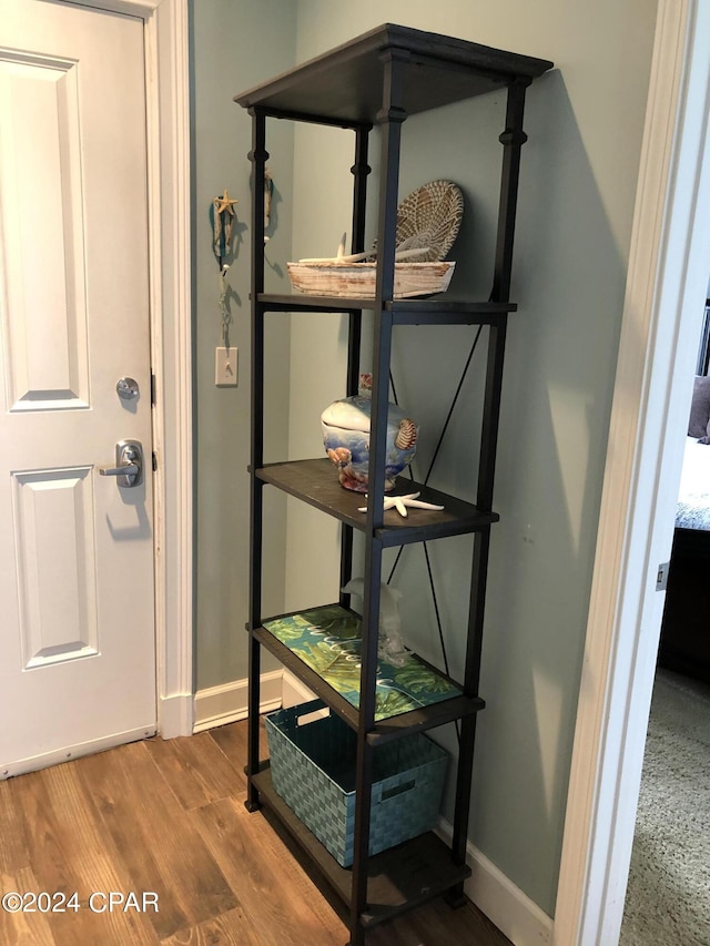 room details featuring baseboards and wood finished floors