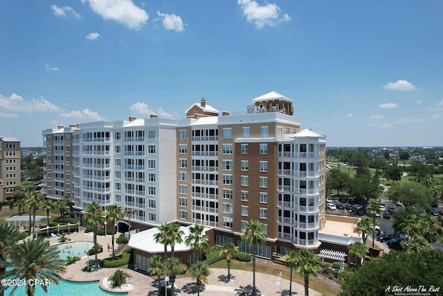 view of property featuring a community pool