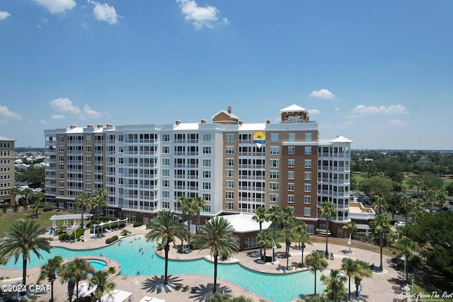 community pool with a patio area