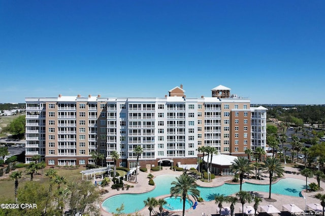 view of property featuring a community pool