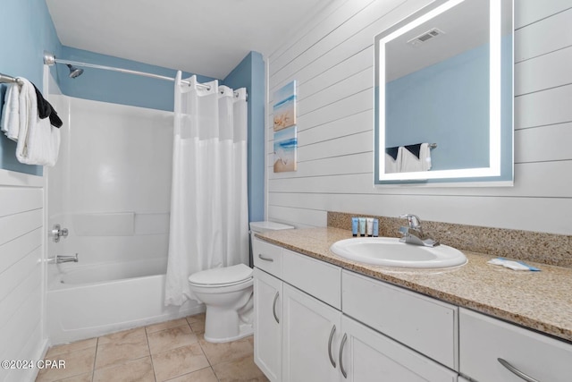 full bathroom featuring wooden walls, vanity, shower / bath combo, and toilet