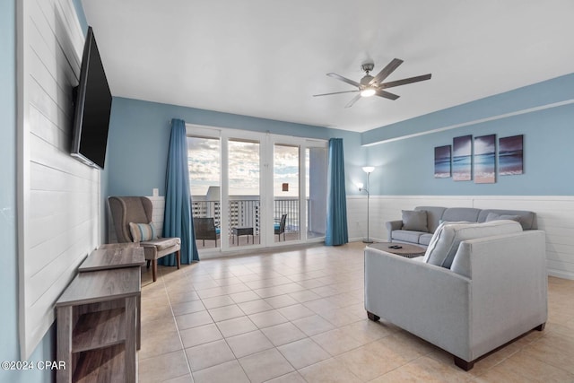 tiled living room featuring ceiling fan