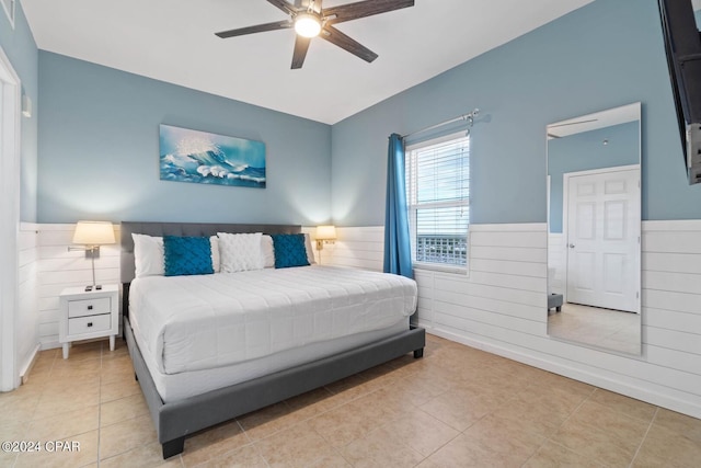 tiled bedroom with ceiling fan