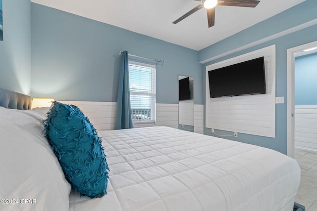 bedroom with light tile floors and ceiling fan