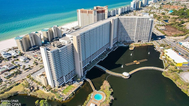 birds eye view of property with a water view