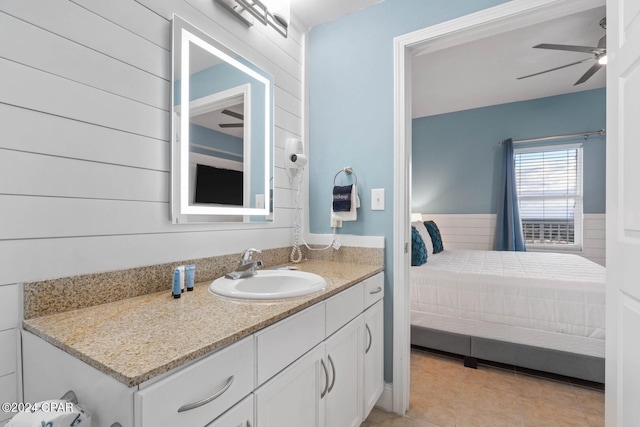 bathroom featuring tile flooring, large vanity, and ceiling fan