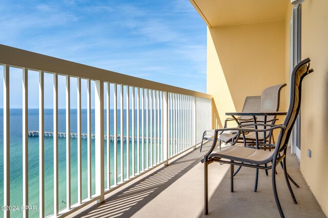 balcony featuring a water view