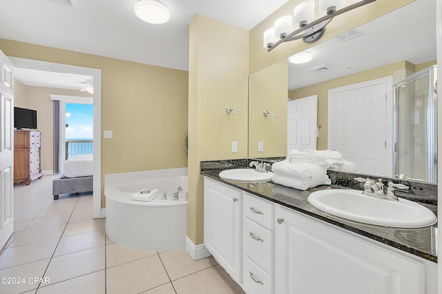 bathroom featuring vanity, tile patterned floors, plus walk in shower, and ceiling fan