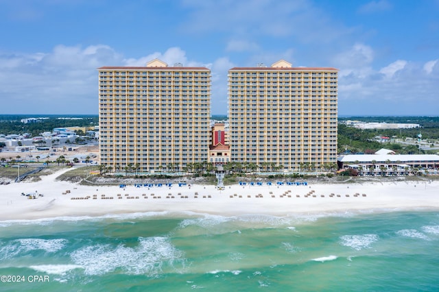 aerial view featuring a water view and a view of the beach