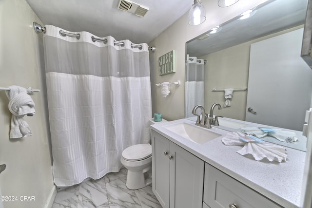 bathroom featuring a shower with curtain, vanity, and toilet