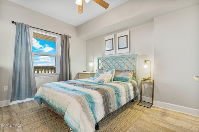 bedroom with ceiling fan and light hardwood / wood-style flooring