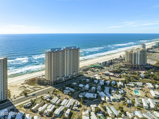 birds eye view of property featuring a beach view and a water view