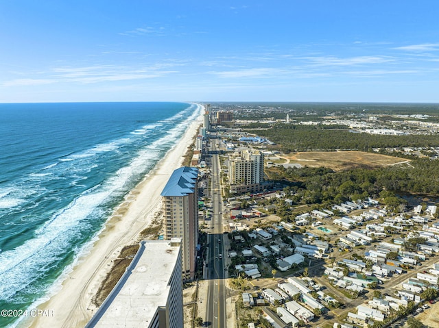 birds eye view of property with a water view and a view of the beach