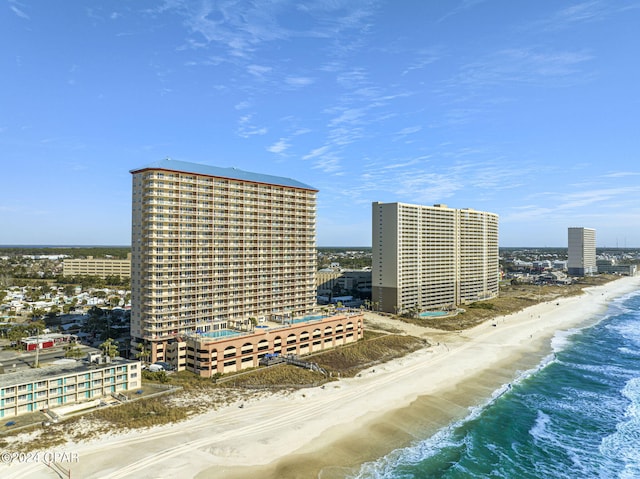 birds eye view of property featuring a water view and a view of the beach