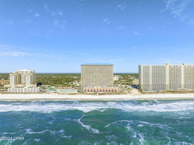 view of swimming pool featuring a beach view and a water view