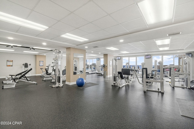 exercise room with a paneled ceiling