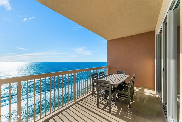 balcony featuring a water view