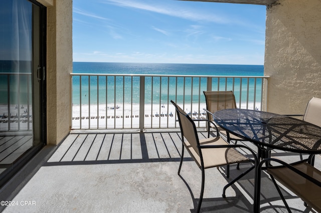 balcony with a view of the beach and a water view