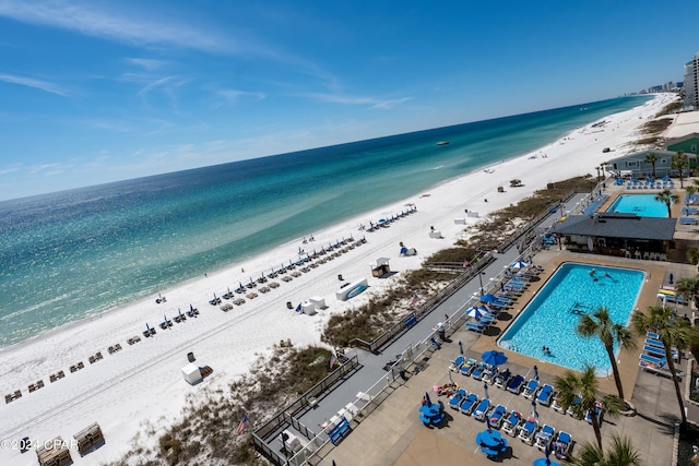 aerial view with a water view and a beach view