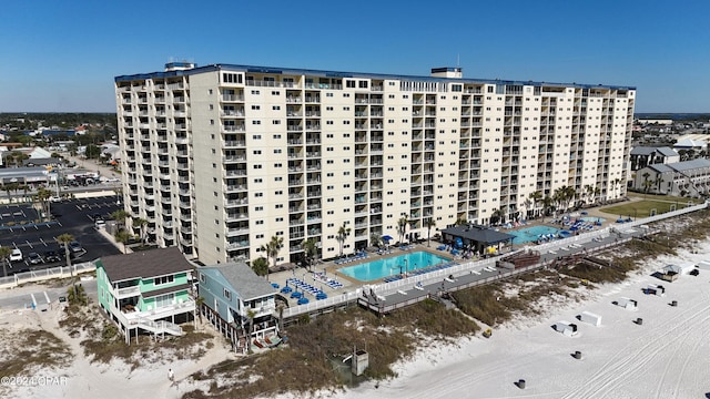 view of building exterior with a community pool