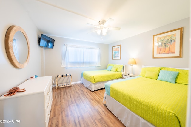 bedroom featuring wood-type flooring and ceiling fan