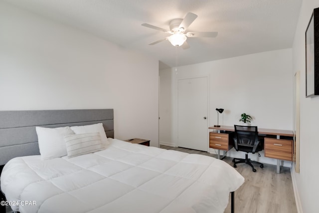 bedroom with ceiling fan and light wood-type flooring