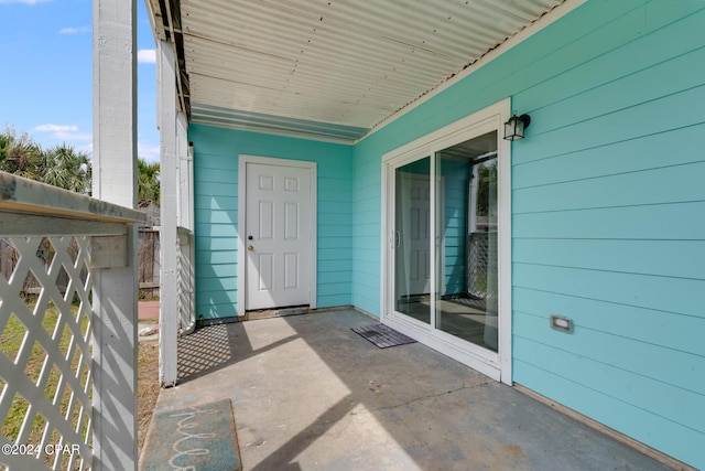 entrance to property with a patio