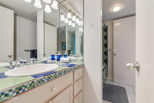 bathroom with tile floors and vanity with extensive cabinet space