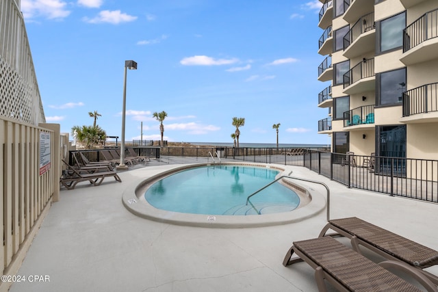 view of swimming pool featuring a patio area