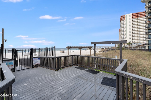 wooden terrace featuring a water view