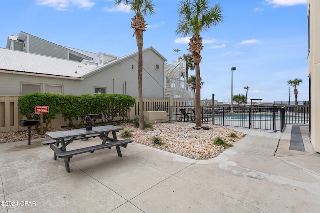 view of patio with a community pool